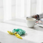 ربطة شعر بلون النعناع/الأصفر الباهت من كول إت تشوشو