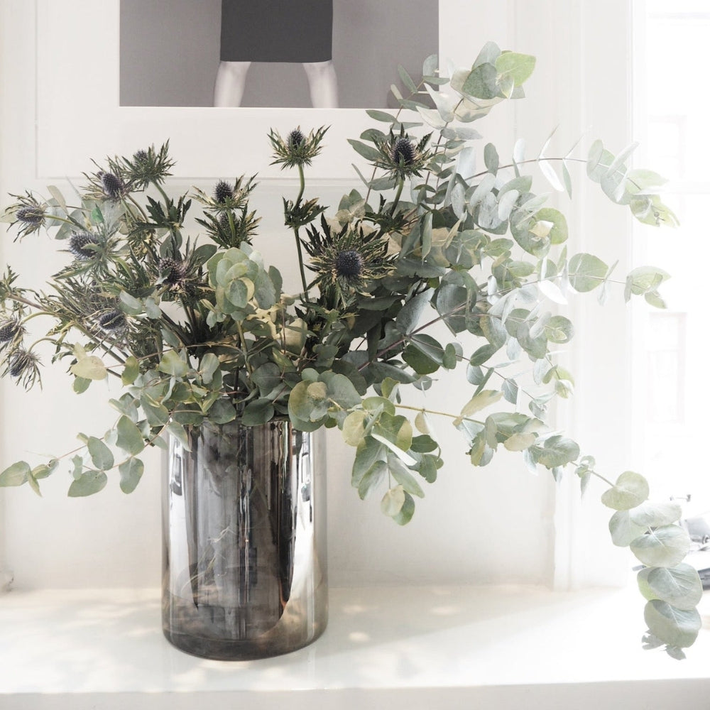 Skogsberg & Smart Silver Hurricane Lamp, Large, styled in a room setting